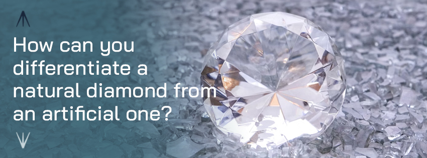 How can you differentiate a natural diamond from an artificial one?